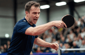 a ping pong player after a strong serve