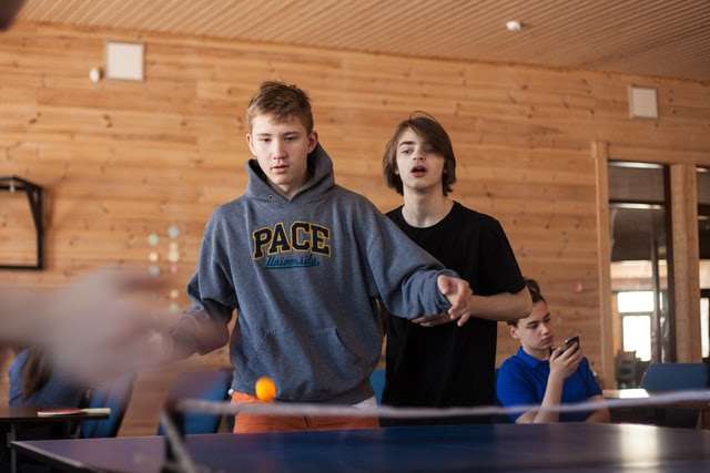 Playing table tennis with a doubles partner