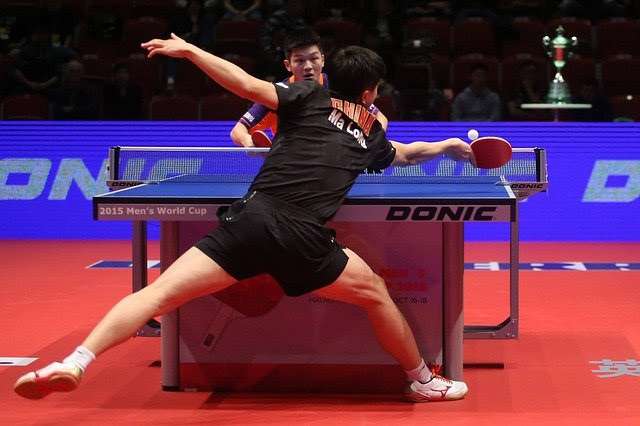 Ma Long playing against Fan Zhendong