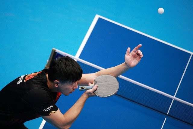 Ma Long serving in table tennis