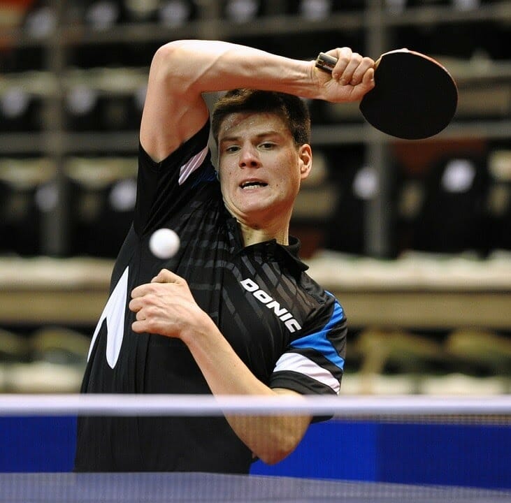 Dimitrij Ovtcharov hitting ping pong ball hard